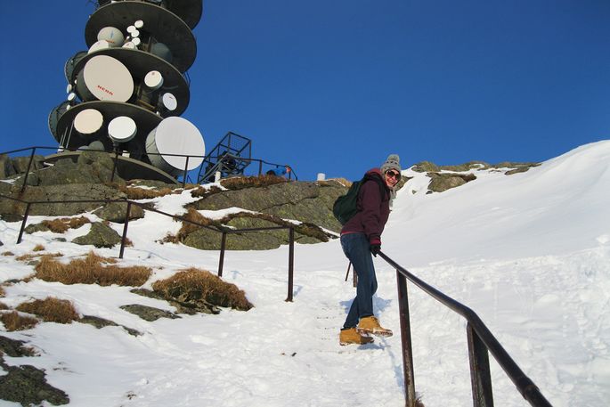 student climbing a snow-covered walkway