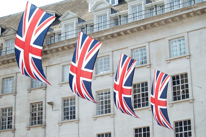 United Kingdom flags hanging in front of a building