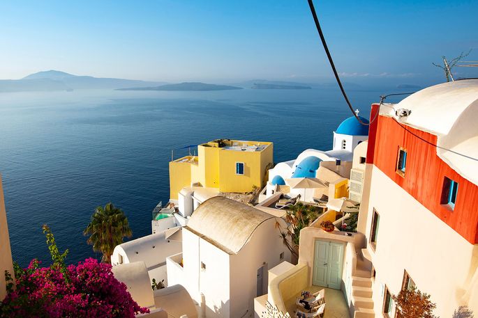 colorful buildings on a Greek island in front of the sea