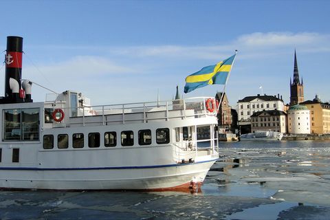 boat with Swedish flag on the water in Sweden