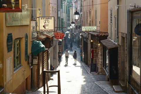 two students walking on a narrow French street