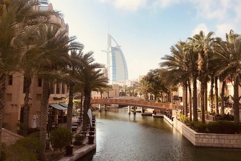 river with a view of the Burj Al Arab hotel in the distance