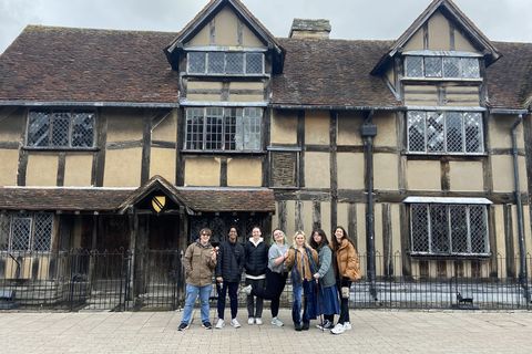 A group of students pose for a photo in front of Shakespeare's birthplace in London