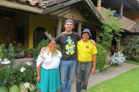 Student with Ecuadorian family outside their home